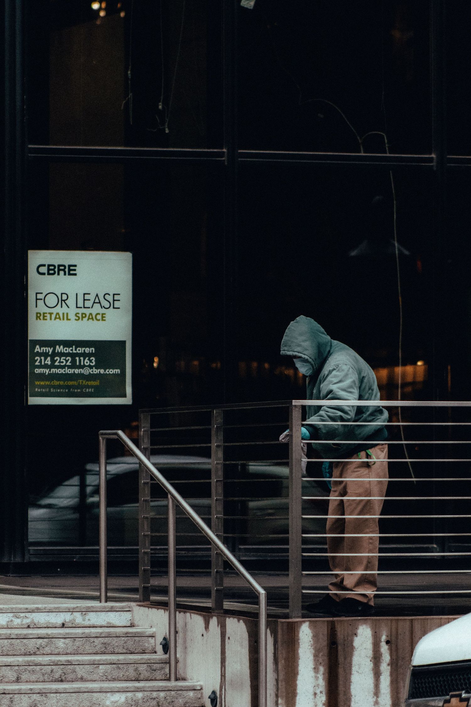 Man in Mask Cleaning Railing