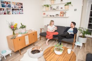 Modern home interior lifestyle session showing casual family moments in a bright living room.
