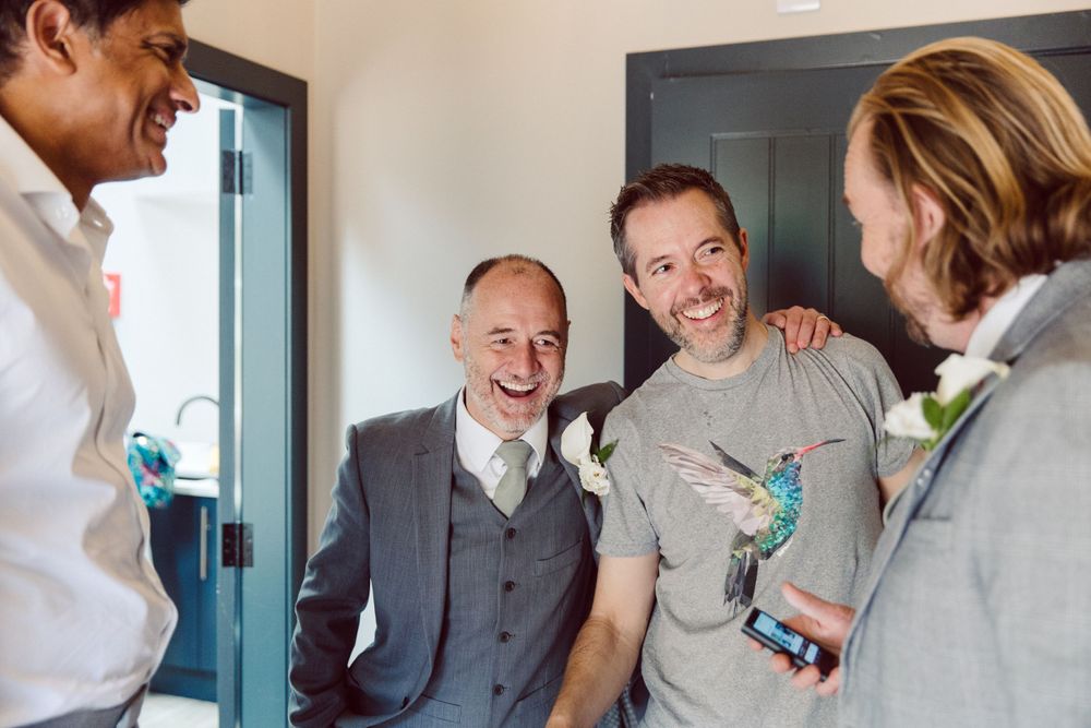 Candid moments of celebration and laughter in modern interior setting.