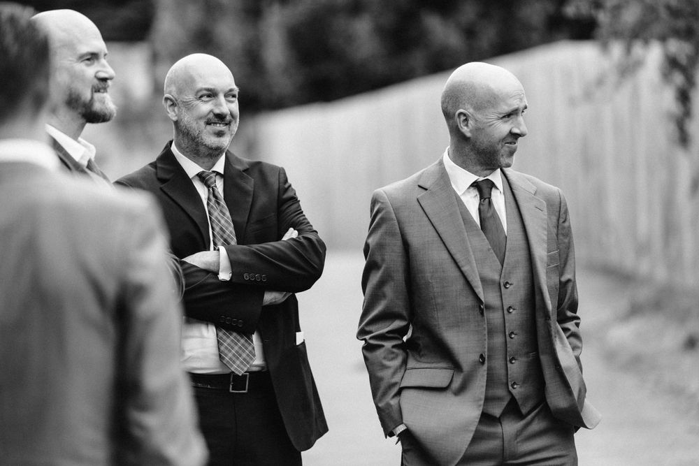 Black and white portraits of guests at formal gathering.