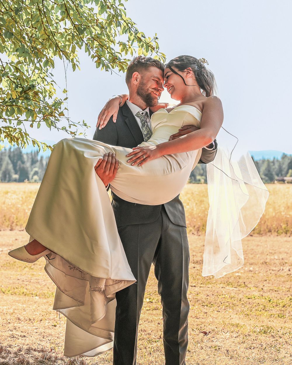 Groom carrying bride.