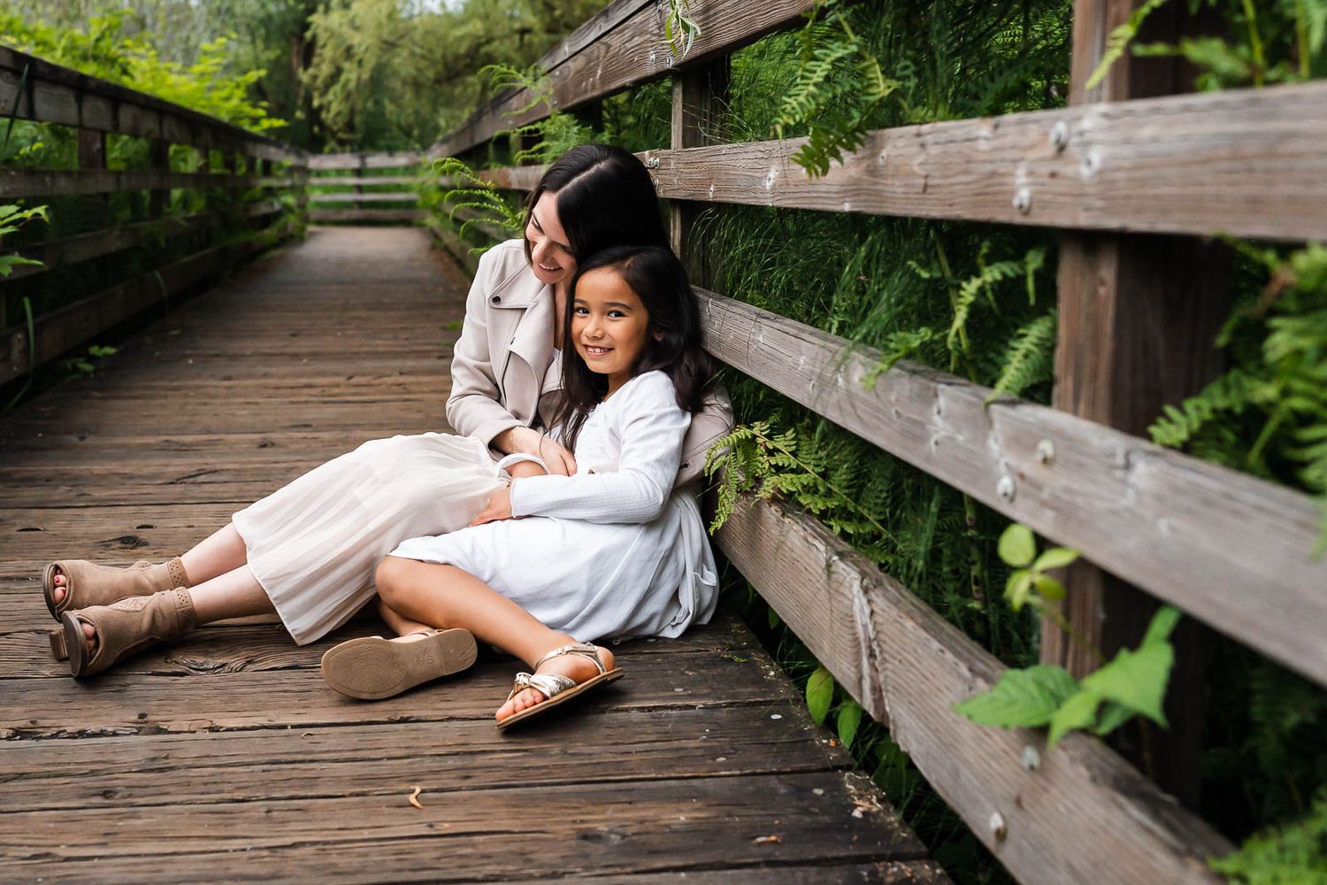Mother daughter smiling on a boardwalk in Kirkland
