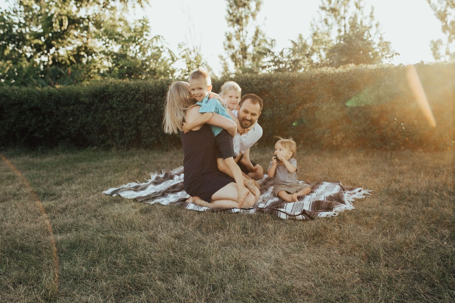family photo playing in grass south haven michigan