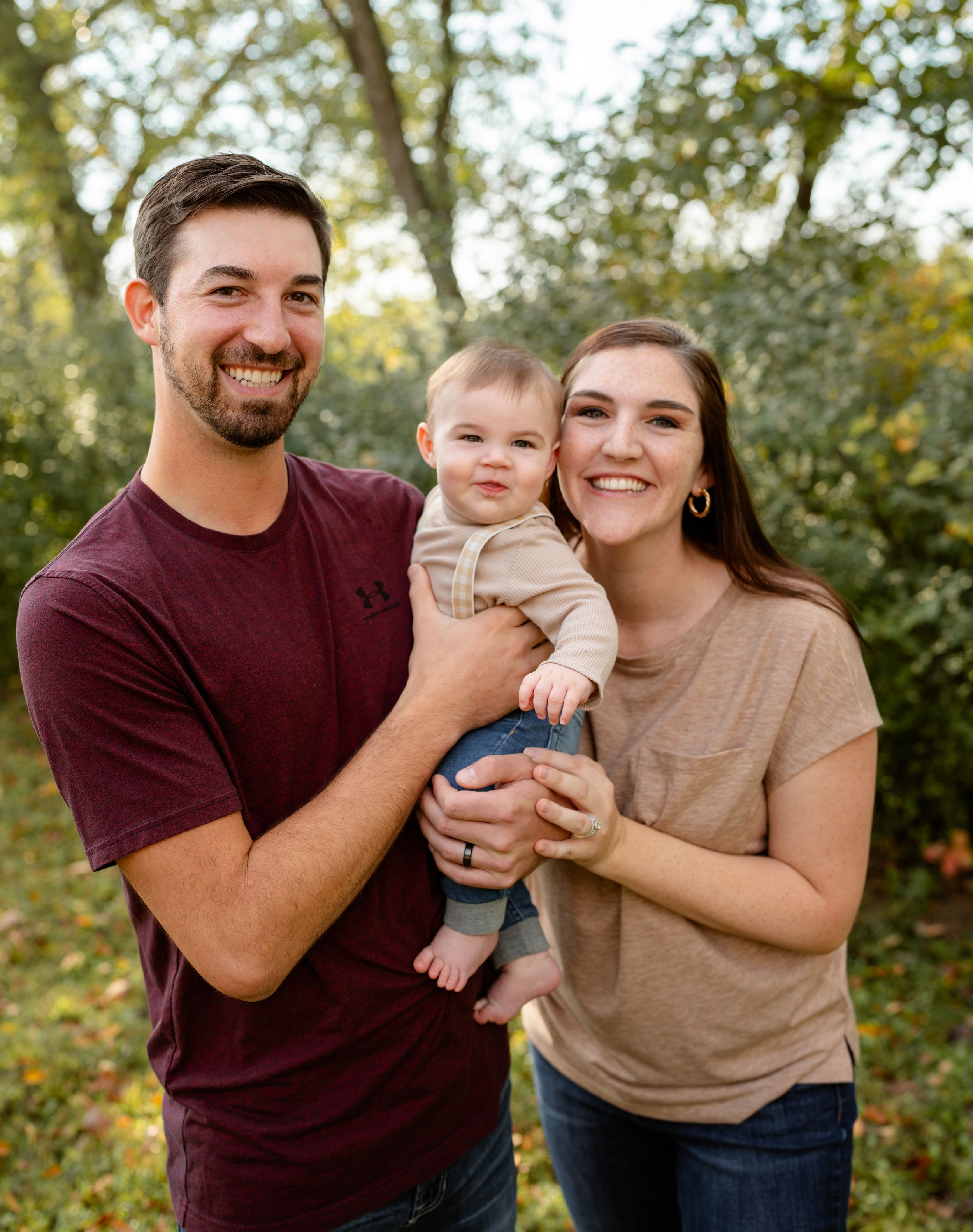 Family and son smiling outdoors
