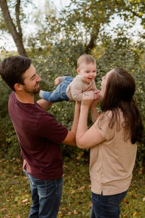Family playing with son