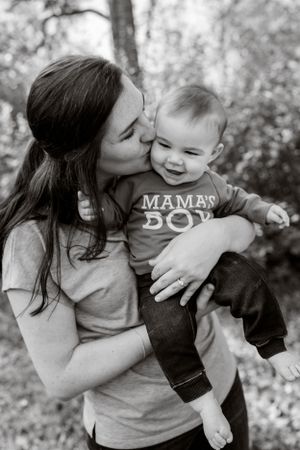 Mom and son getting kisses