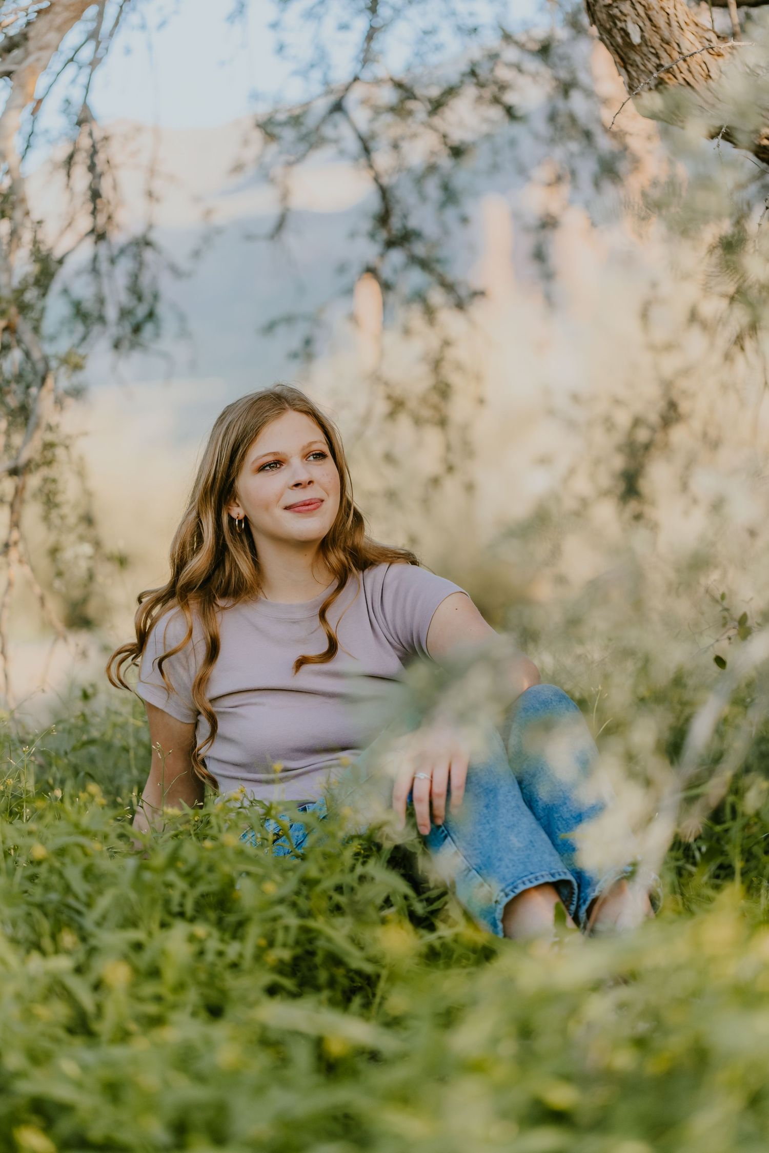 Nature-inspired portrait with ethereal lighting and lush garden backdrop.