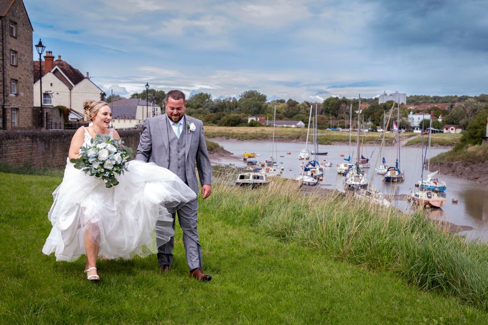 Bride and groom by river creek.