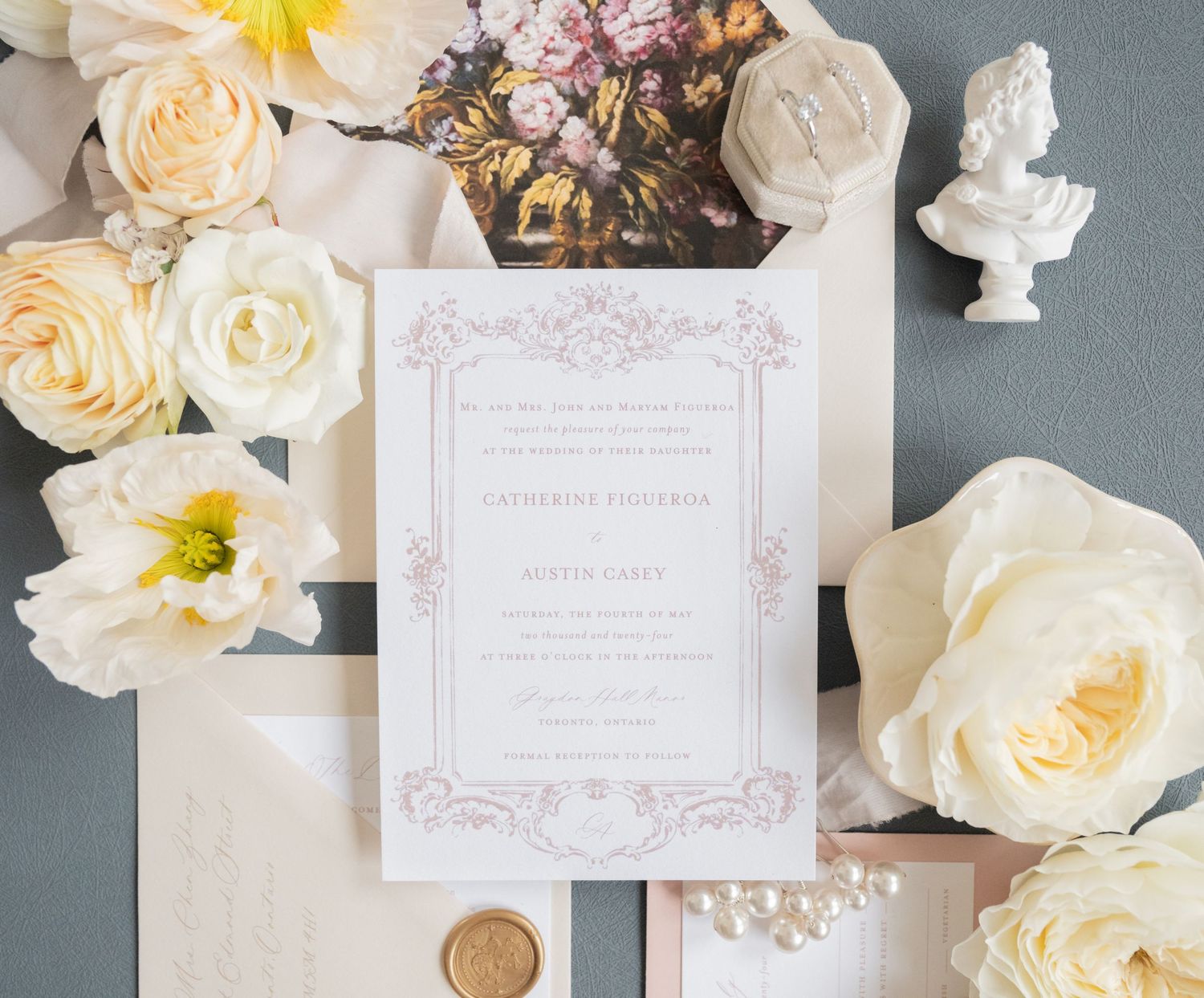 Wedding stationery suite with cream roses, wax seal and floral envelope liner.