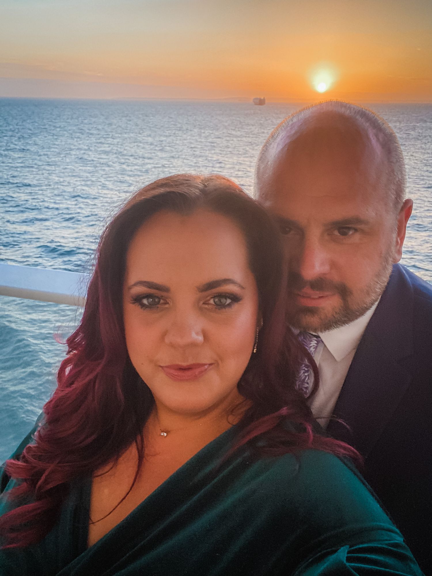 Couple takes romantic selfies at sunset by the ocean in a series of photos.