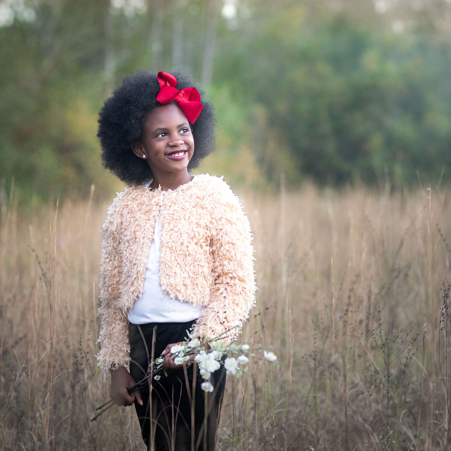 Childhood Portrait in Grassy Field using Natural Light