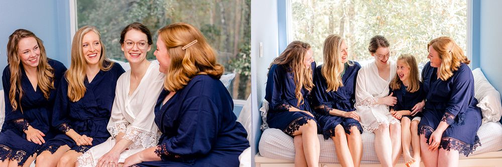 A group wearing matching navy robes sitting together in a bright indoor setting.