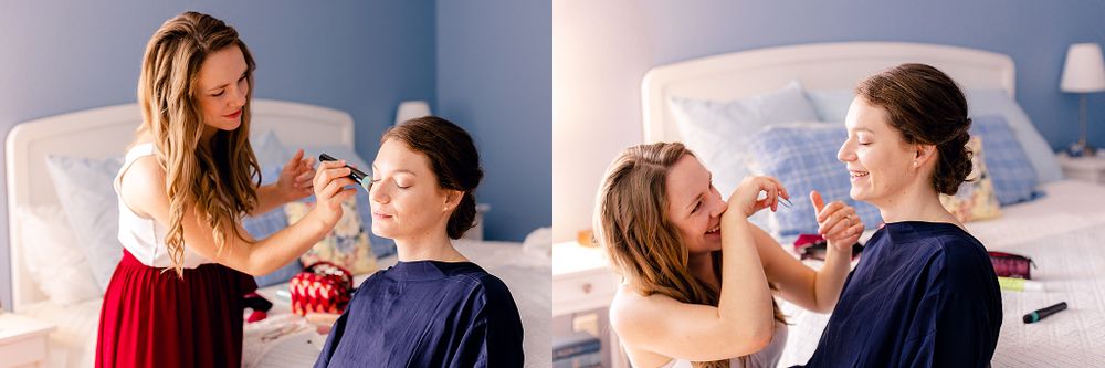A makeup application scene in a blue-walled room.
