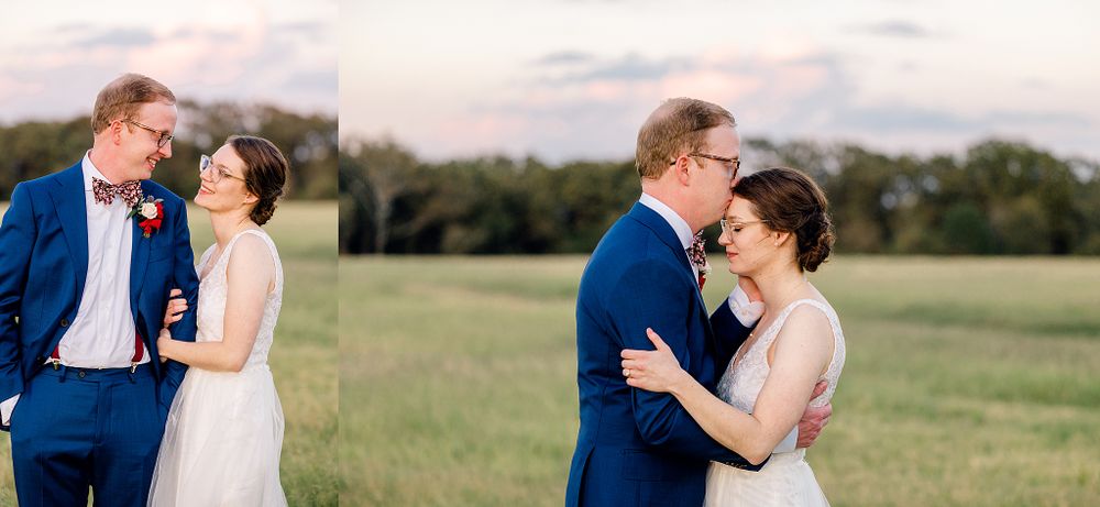 A couple shares an intimate moment in an outdoor field during their wedding photoshoot.