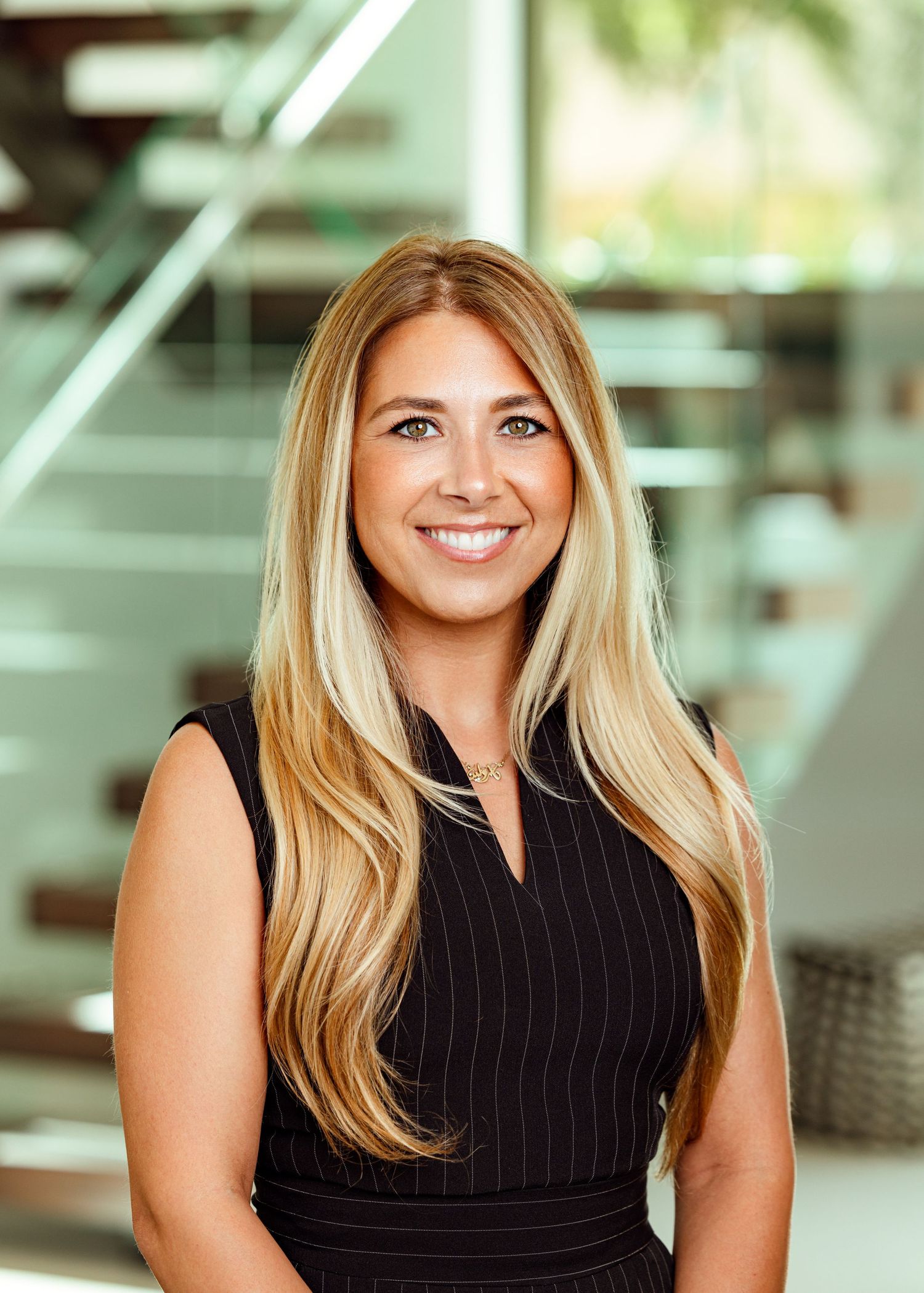 Headshot of female realtor on location in a Fort Lauderdale mansion.