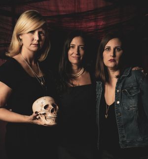 Dark moody portrait series featuring skull props and denim jackets.