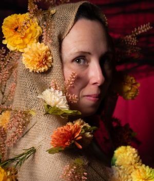 A close-up shot with autumn florals and burlap textures.