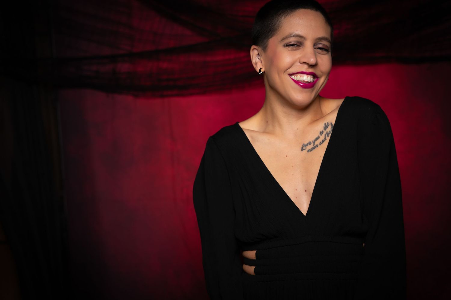 Portrait series featuring vibrant expressions and styling against dark red background.
