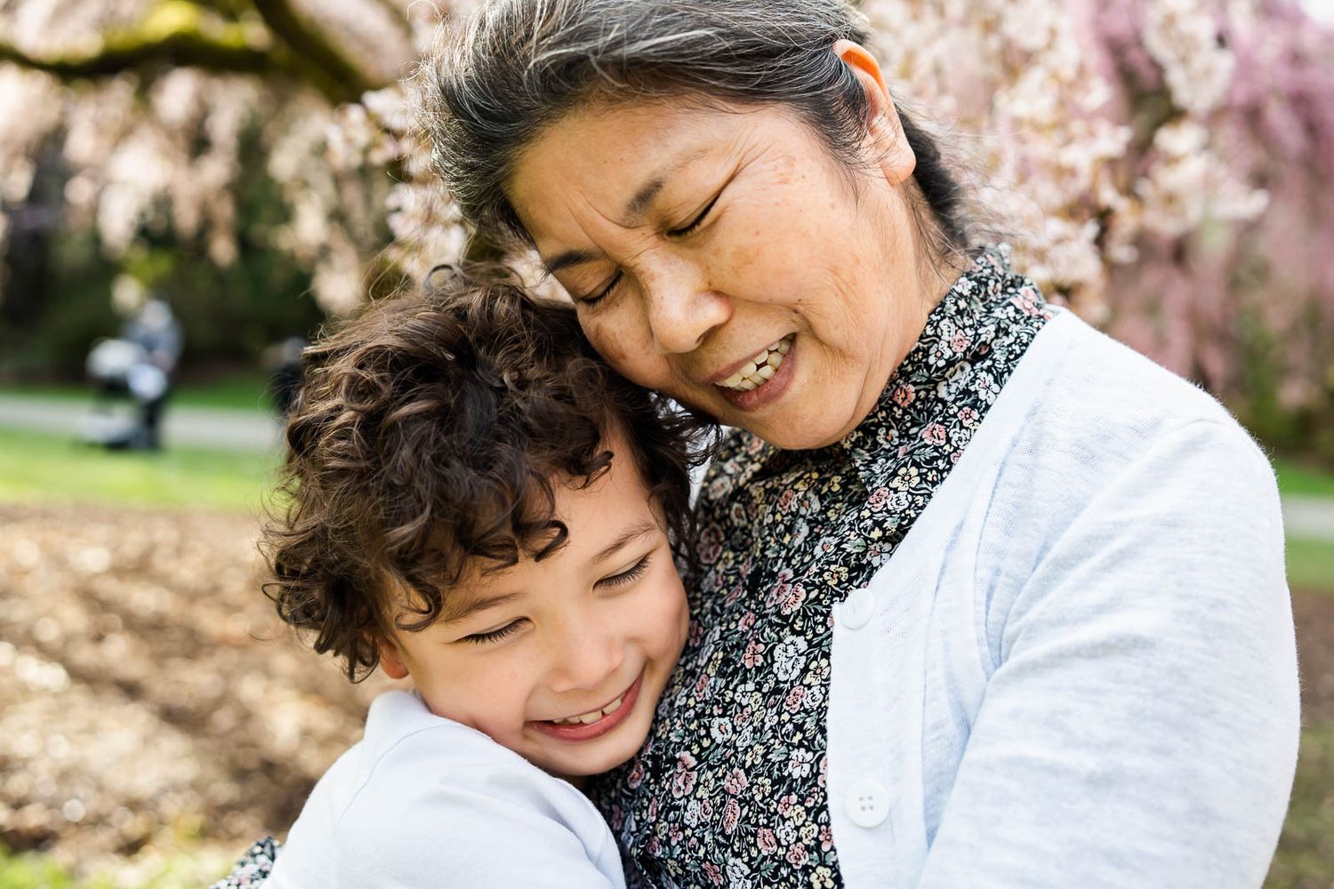 Grandma hugging grandson at the Seattle Arboretum