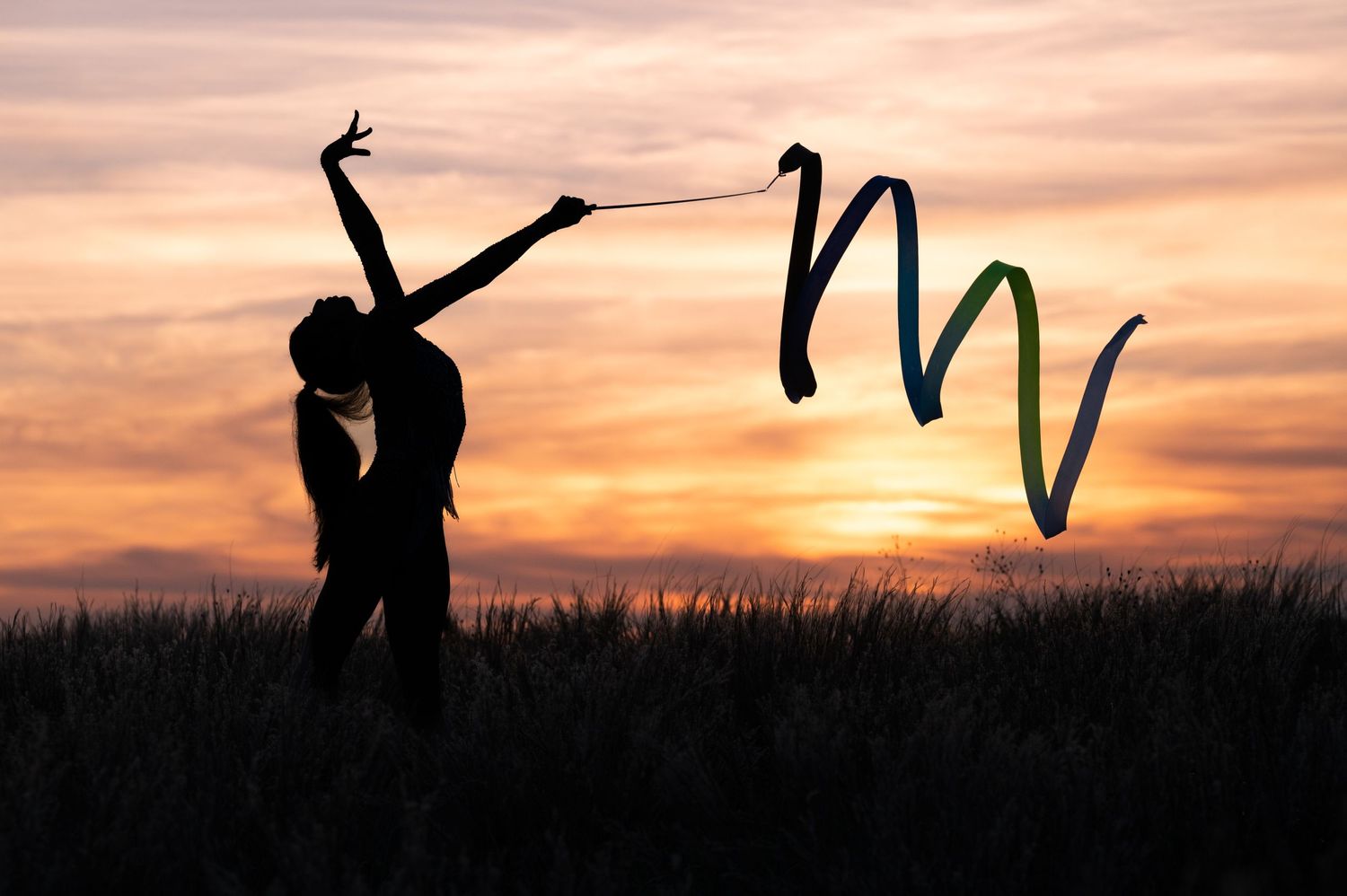 Plymouth, MA photographer Heidi Harting makes stunning sunset silhouette images of high school seniors