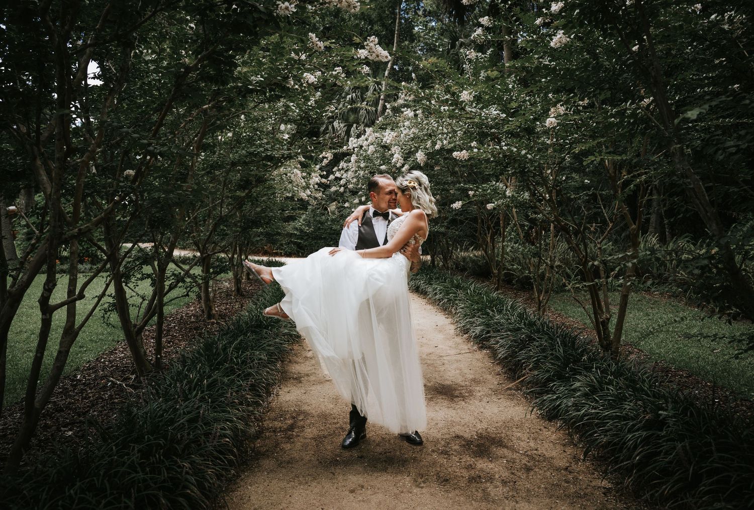Groom carrying Bride in Washington Oaks State Park Florida