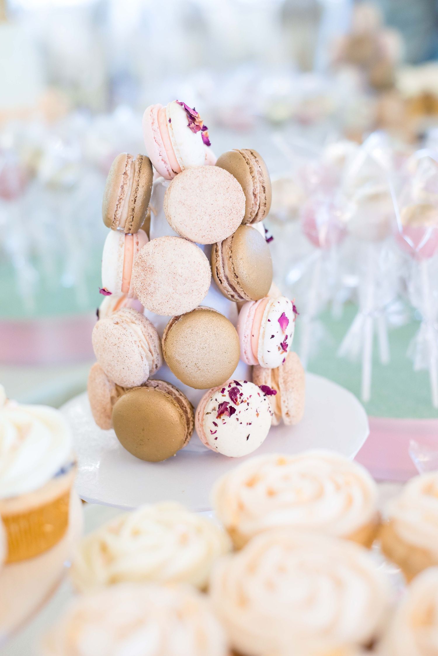 macaroon tower on a dessert table for a baby shower