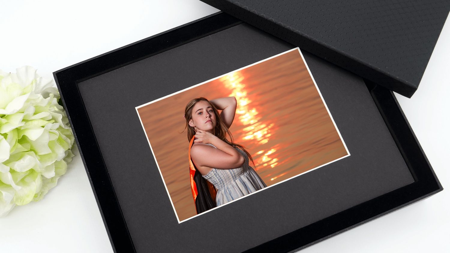 Pattersnap Senior Mariah Hartley at sunset with graduation gown