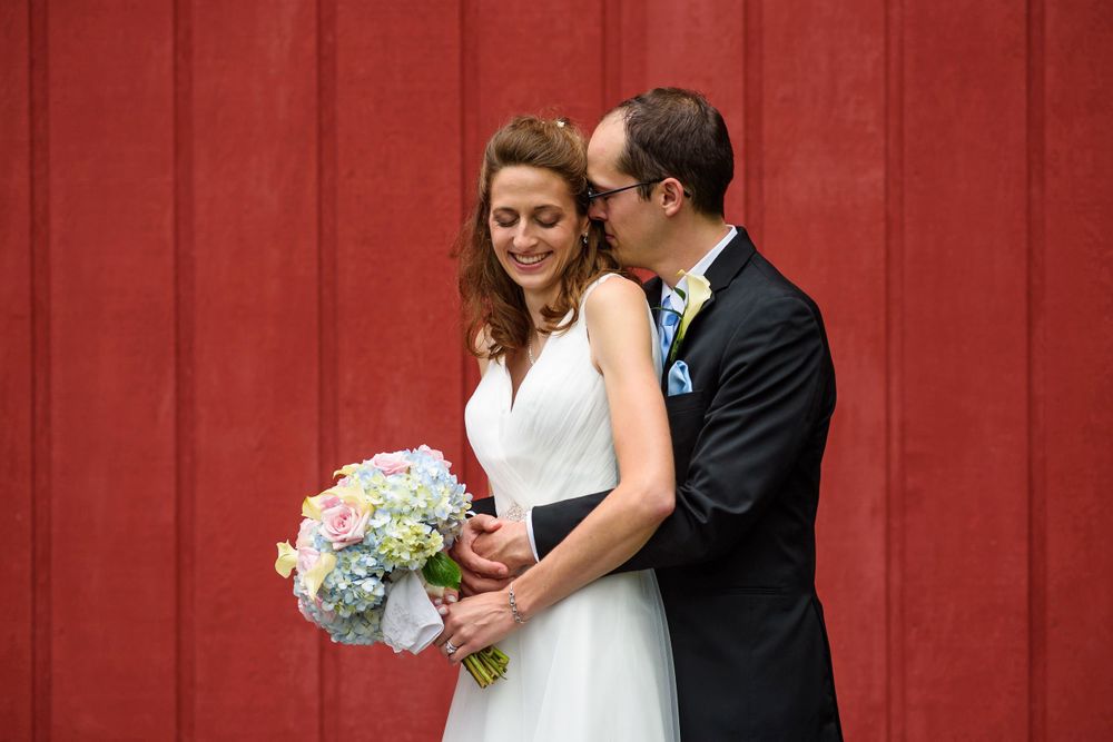Groom embracing bride at Crystal Brook Farm in Chagrin Falls, Ohio.