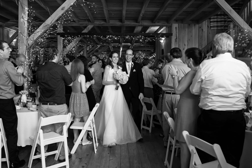 Bride and groom's grand entrance during wedding reception at Crystal Brook Farm in Chagrin Falls, Ohio.