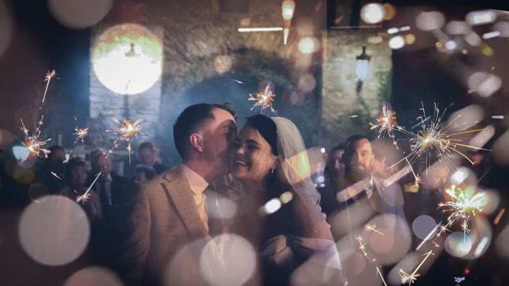 Bride and Groom share a moment under sparklers