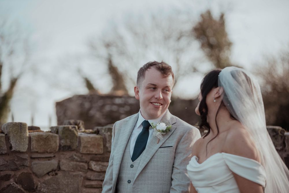 Bride and groom looking at each other