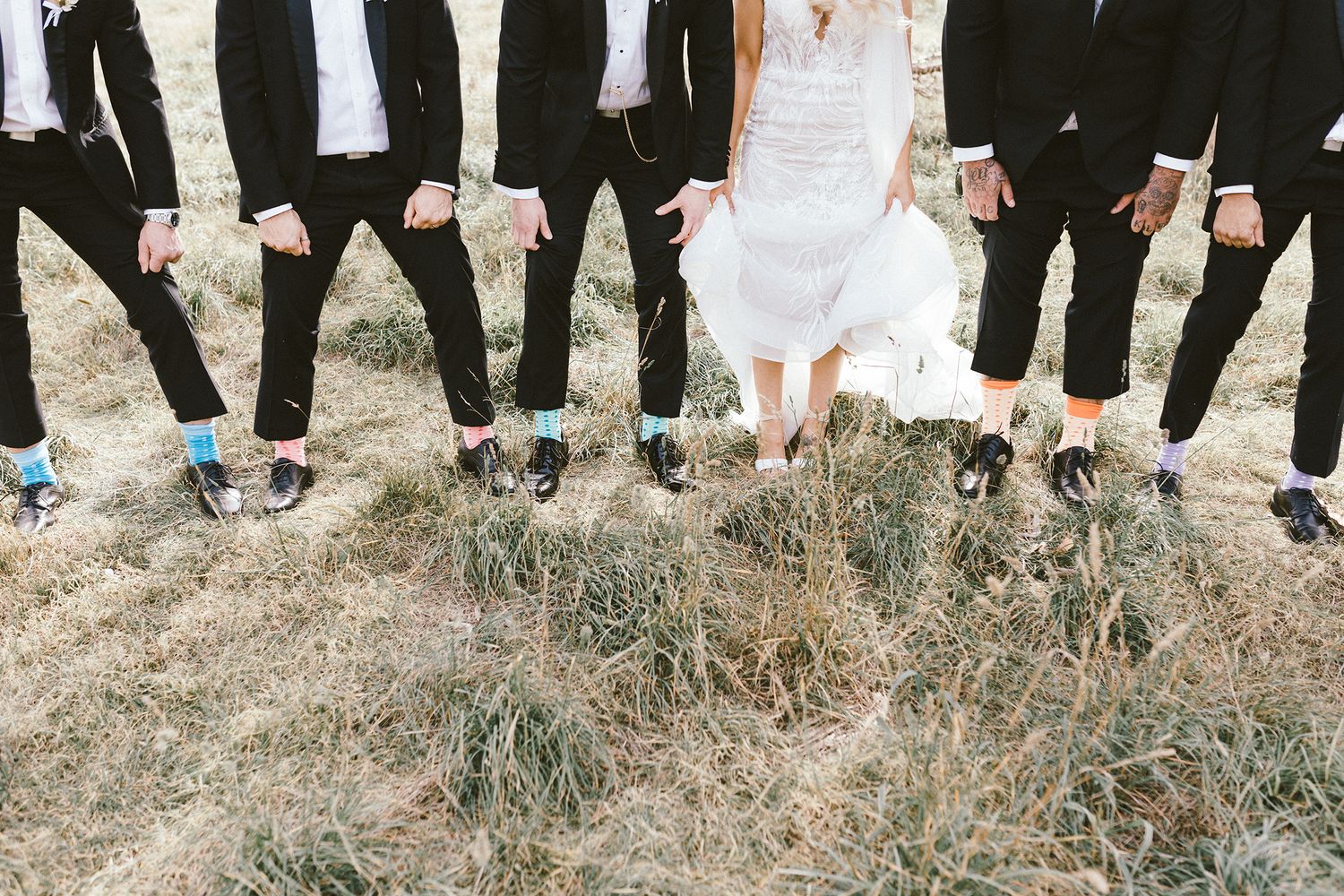 Creative wedding photo focusing on the bridal party's matching socks and shoes.