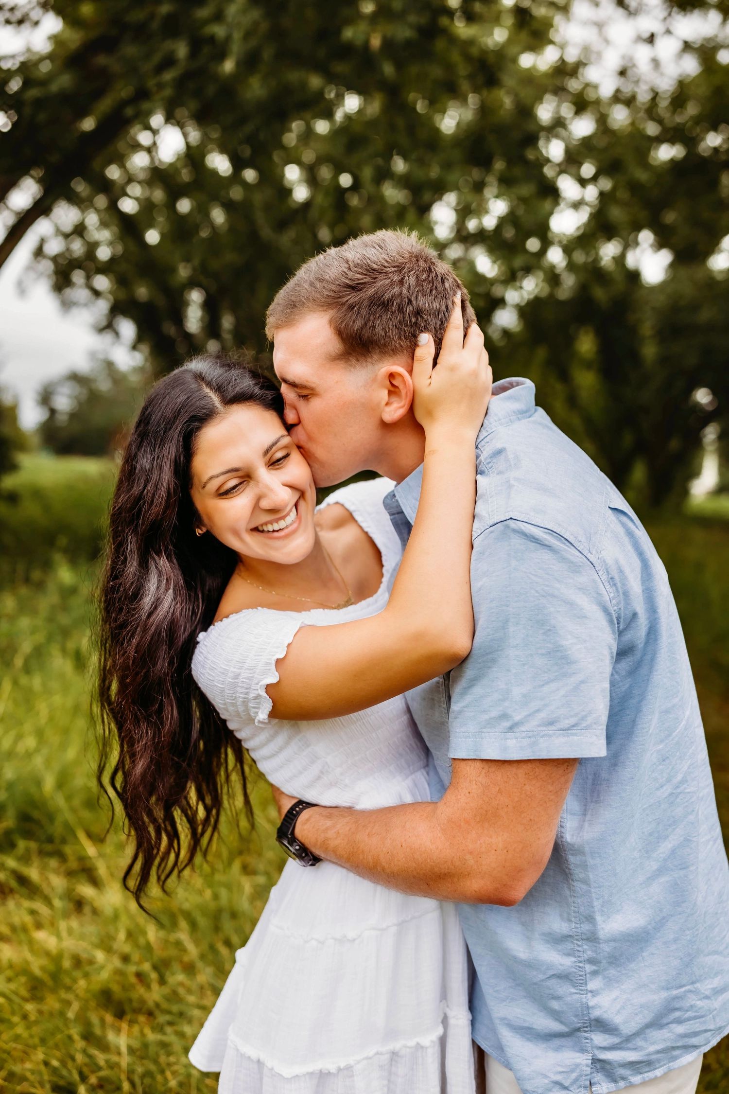 Laughing couple in Hamden, CT enjoys romantic session
