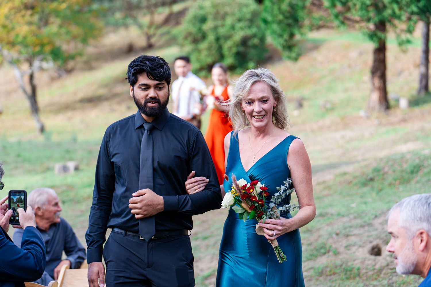 mother of the bride escorted