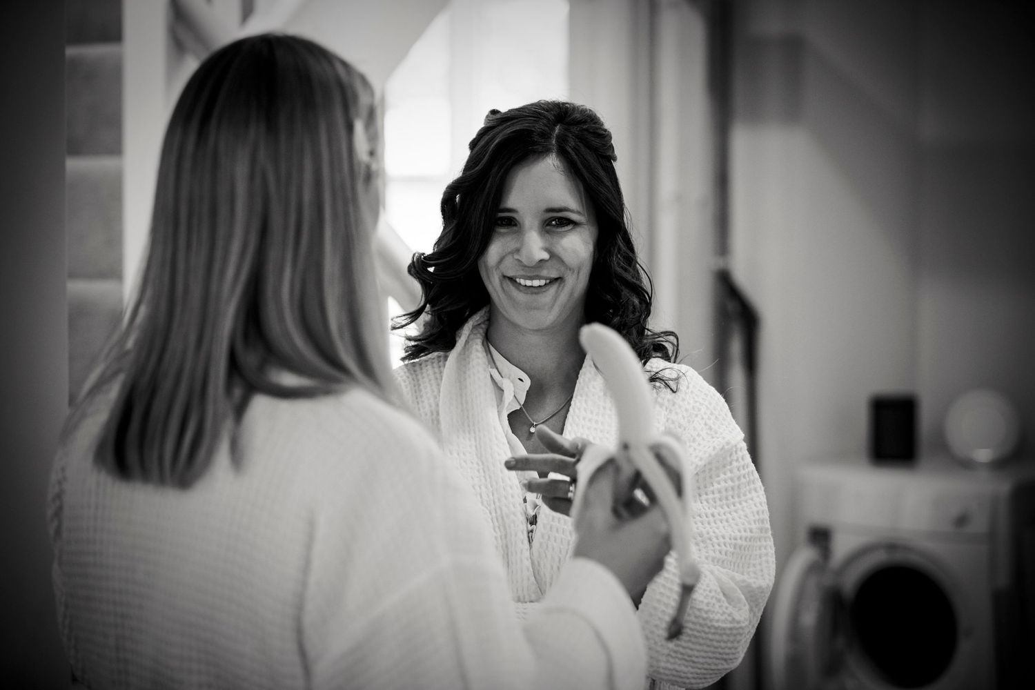 Black and white candid shots in preparation room with natural window light.