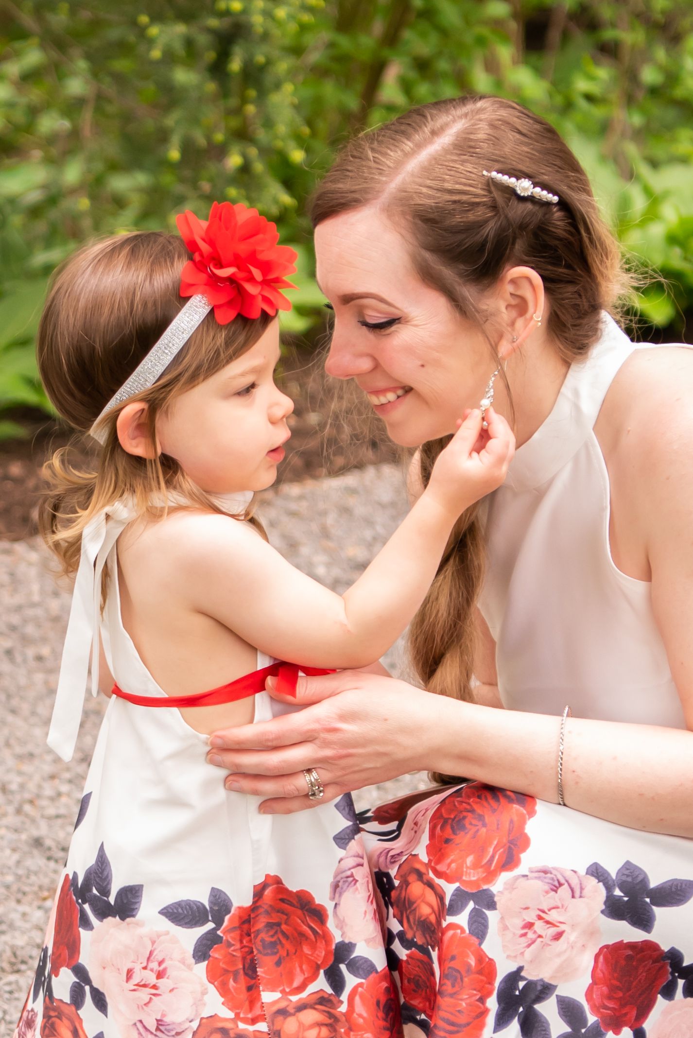 mom and two year old in white dresses in north hills park