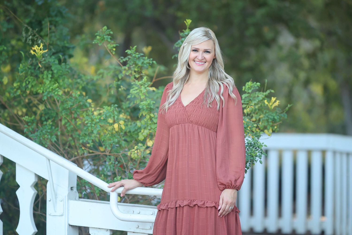 woman wearing copper colored dress at a park