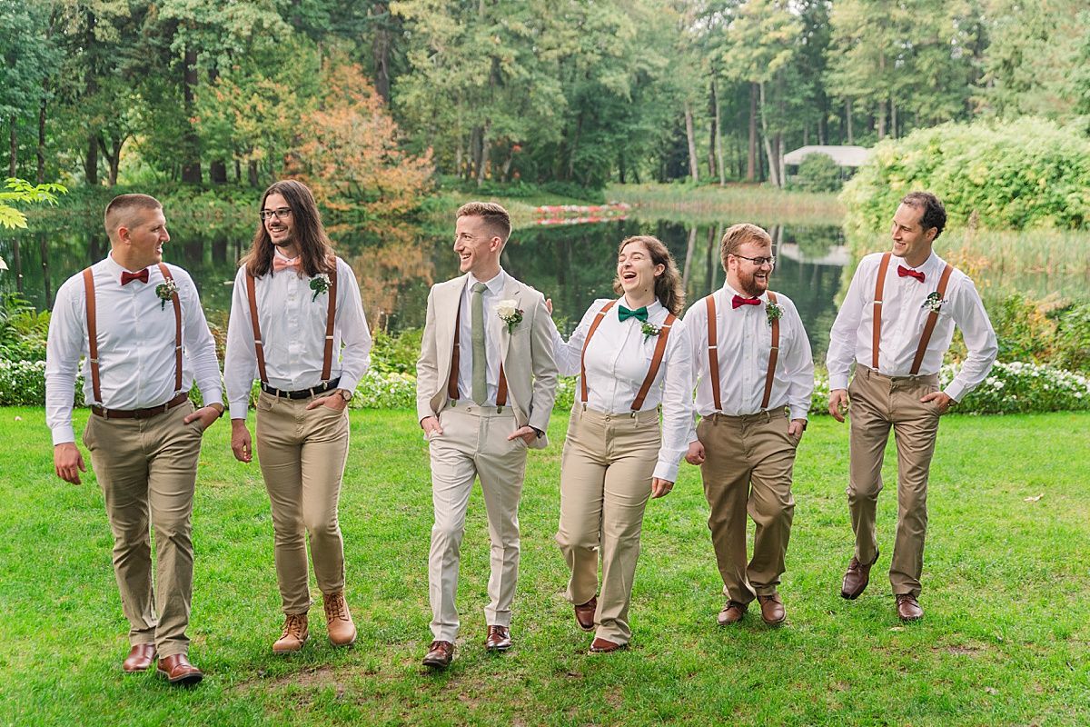 Groom and groomsmen walking for wedding photography