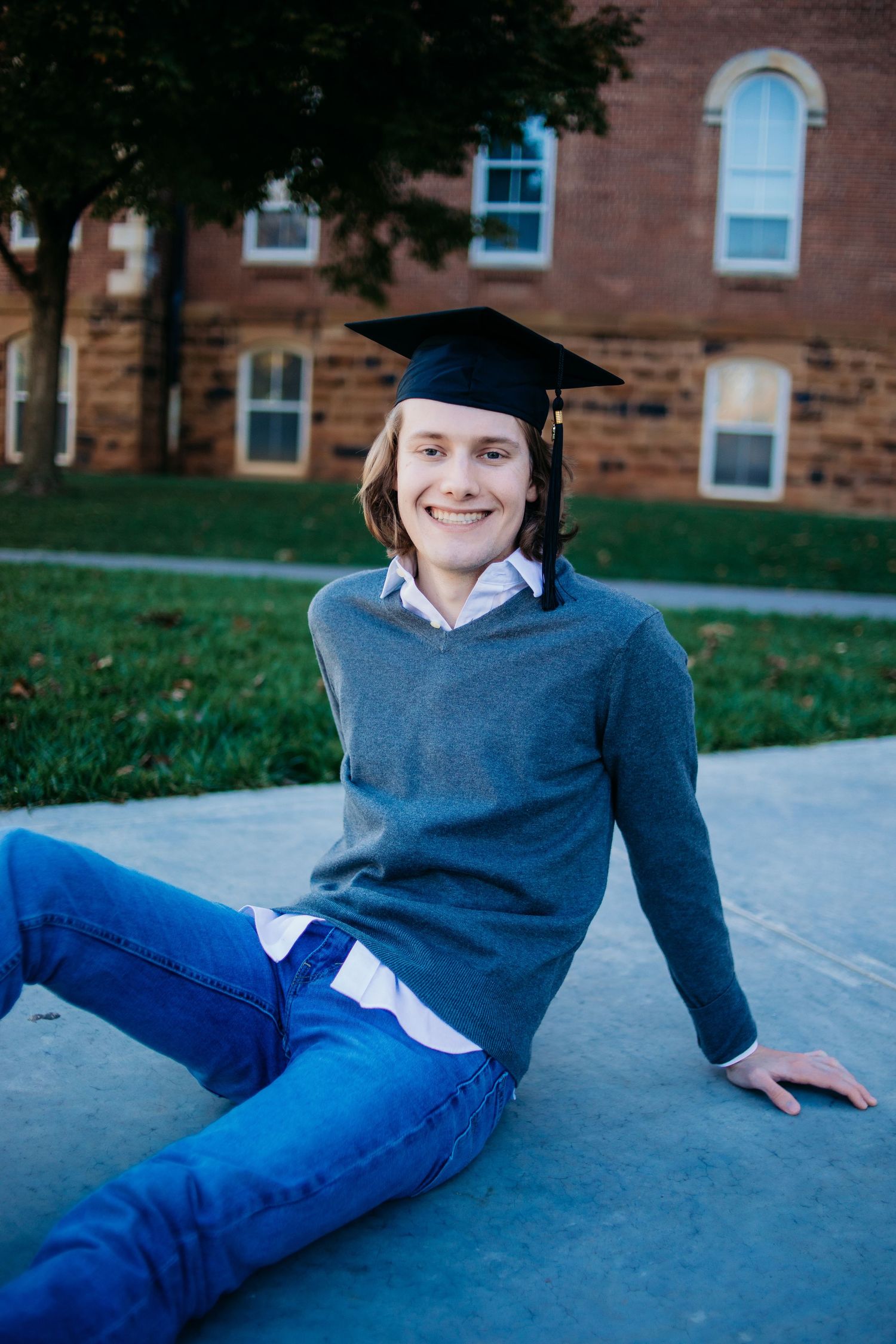 male graduate smiling