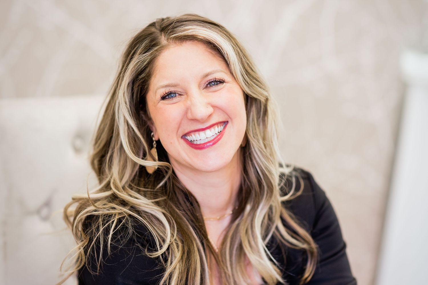 personal branding portrait of hair stylist laughing in salon