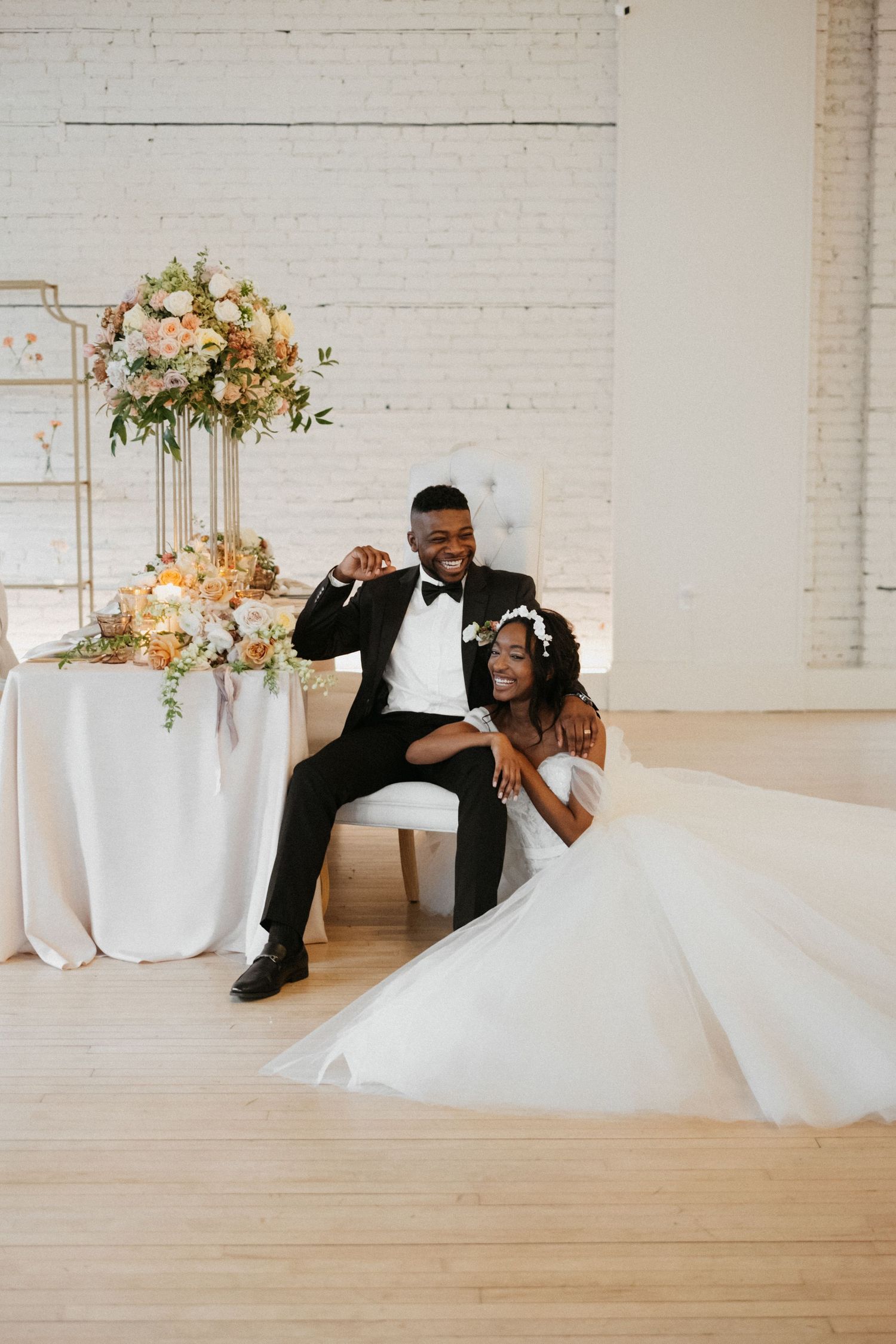 Elegant wedding reception setup with white florals and a joyful celebration.
