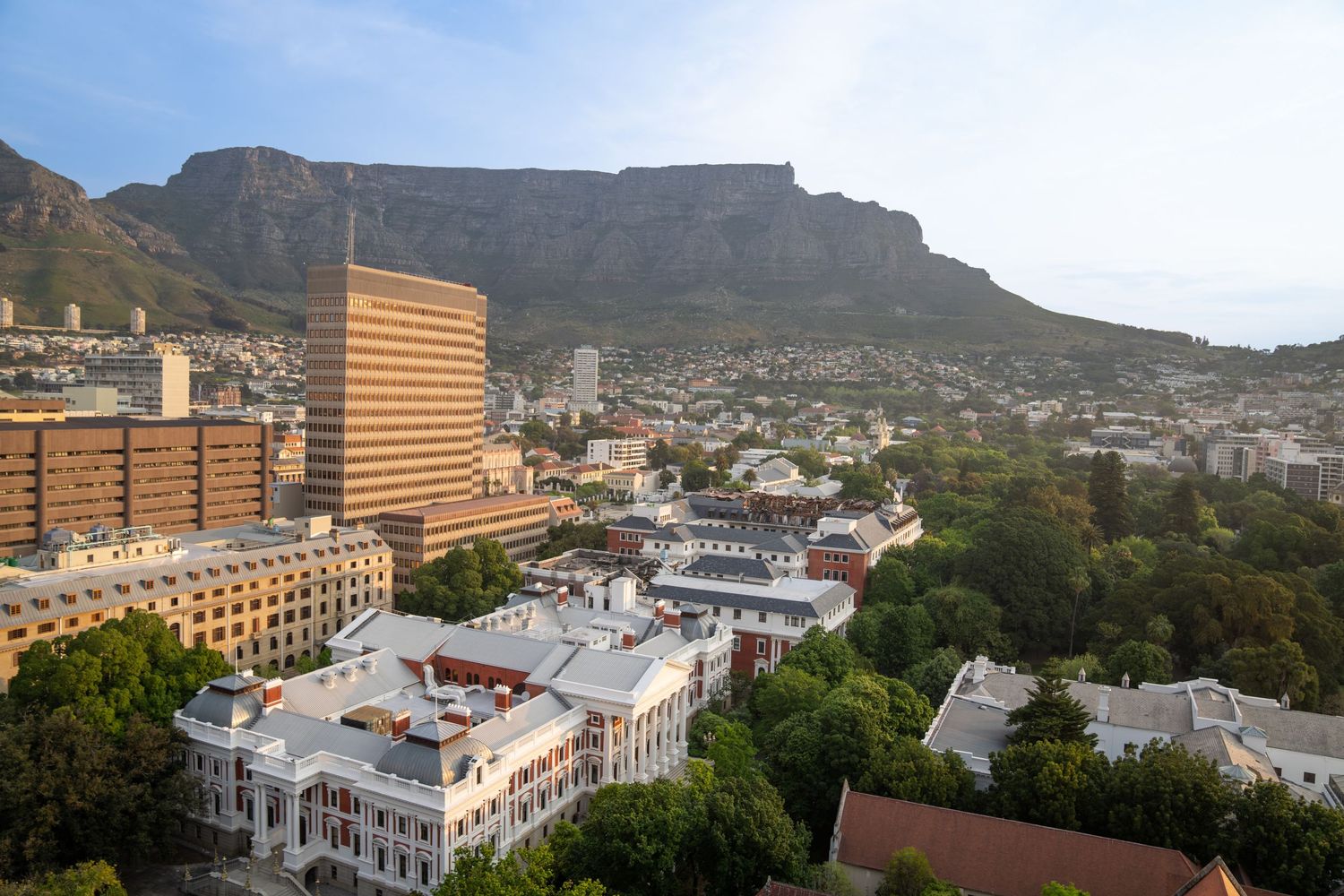 Panoramic views of Cape Town's cityscape with Table Mountain in the background.