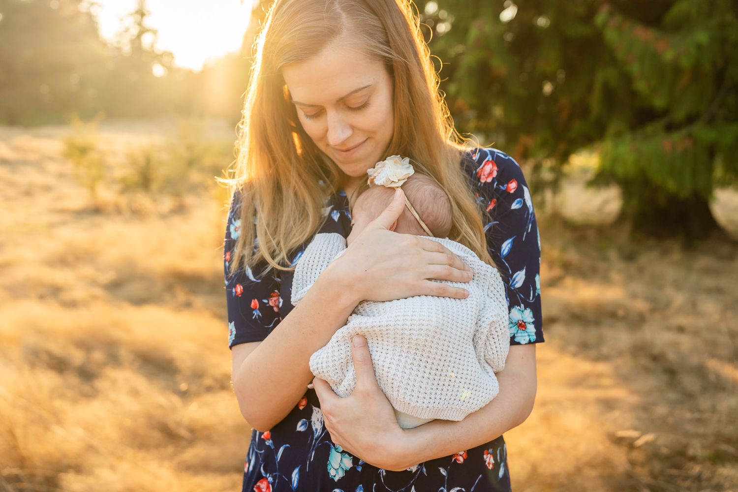 Bellevue newborn photographer captures tender moment of mother holding newborn daughter