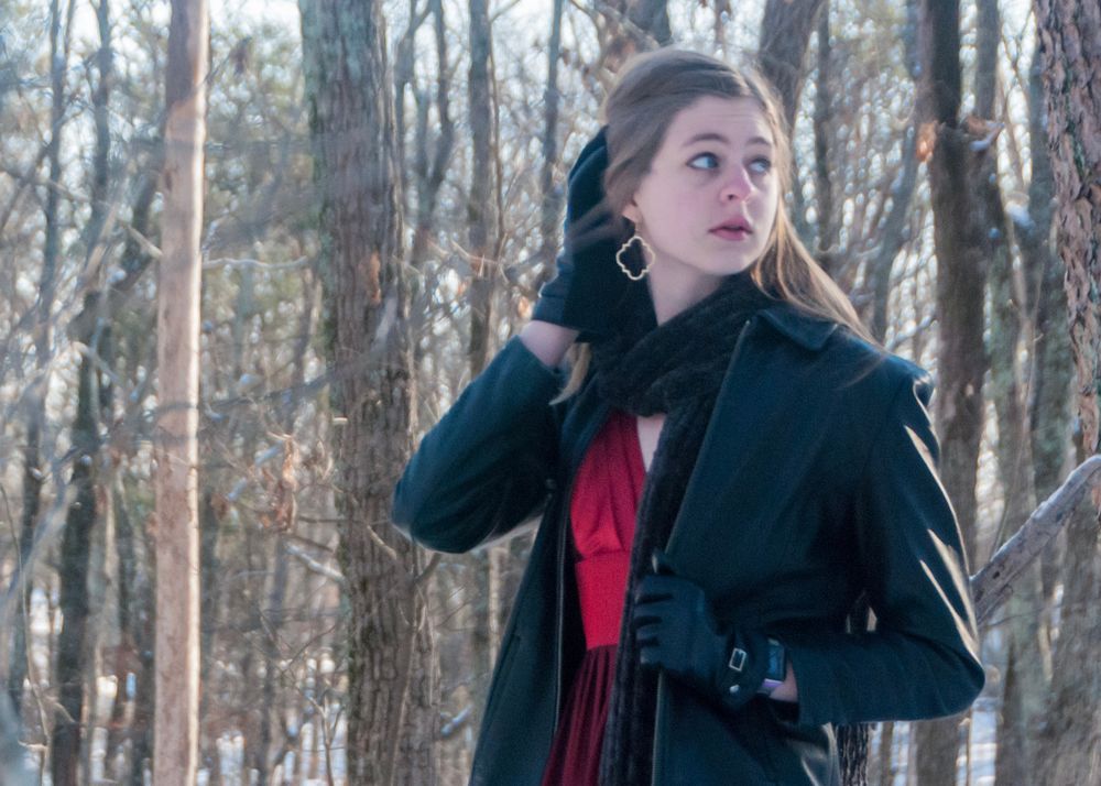 Woman looking over her shoulder in a leather jacket in the snow in Greenville, South Carolina