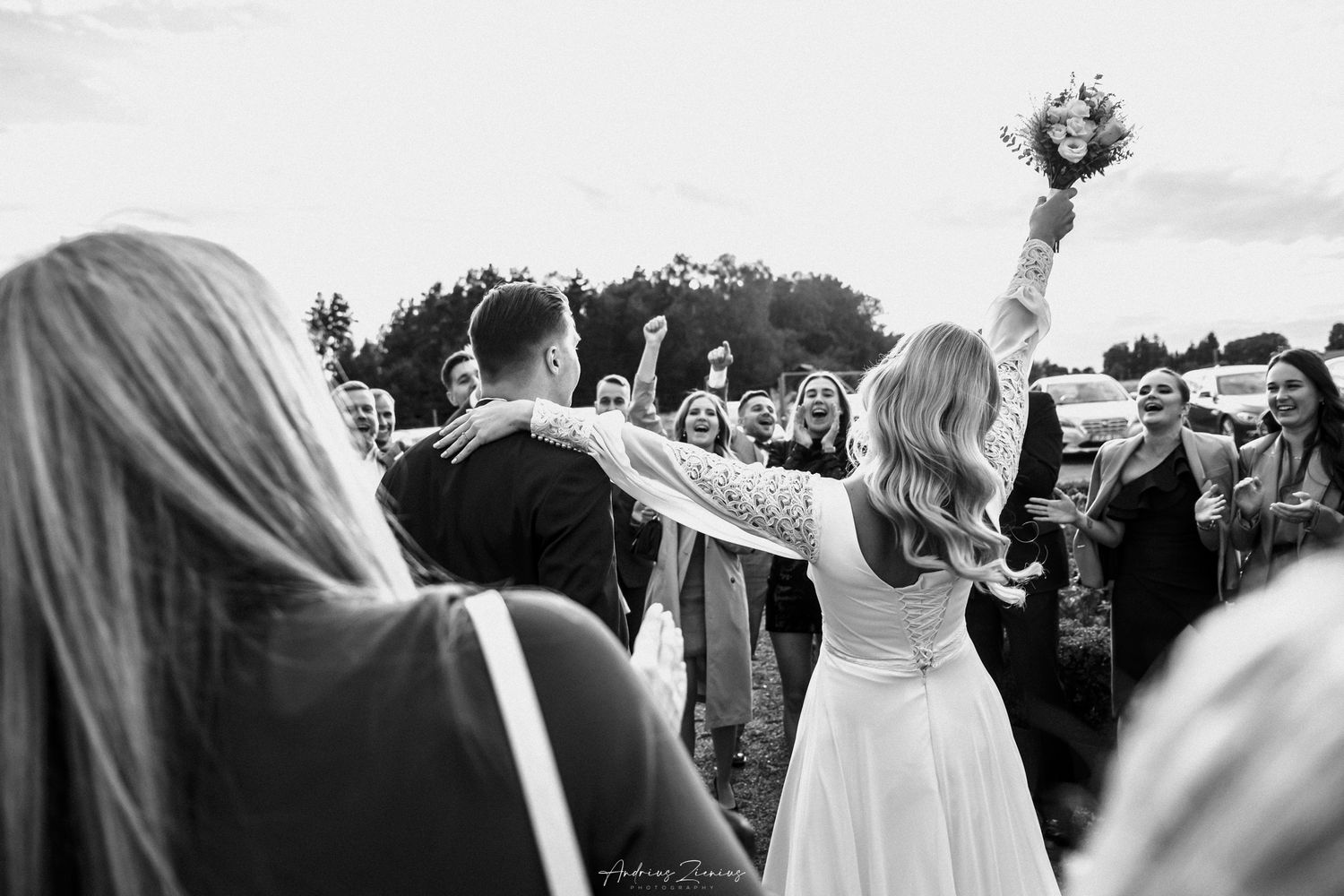 Black and white wedding ceremony photos with guests celebrating the newlyweds.