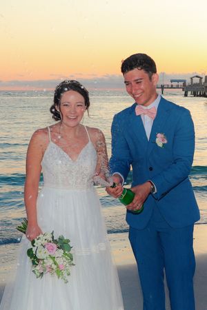 Champagne Celebration on the Shore – Sunset Wedding Photography That Sparkles