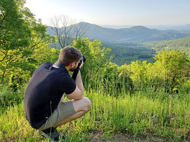 Blue Ridge Parkway overlook photographer Virtually Calhoun taking a photo of mountains