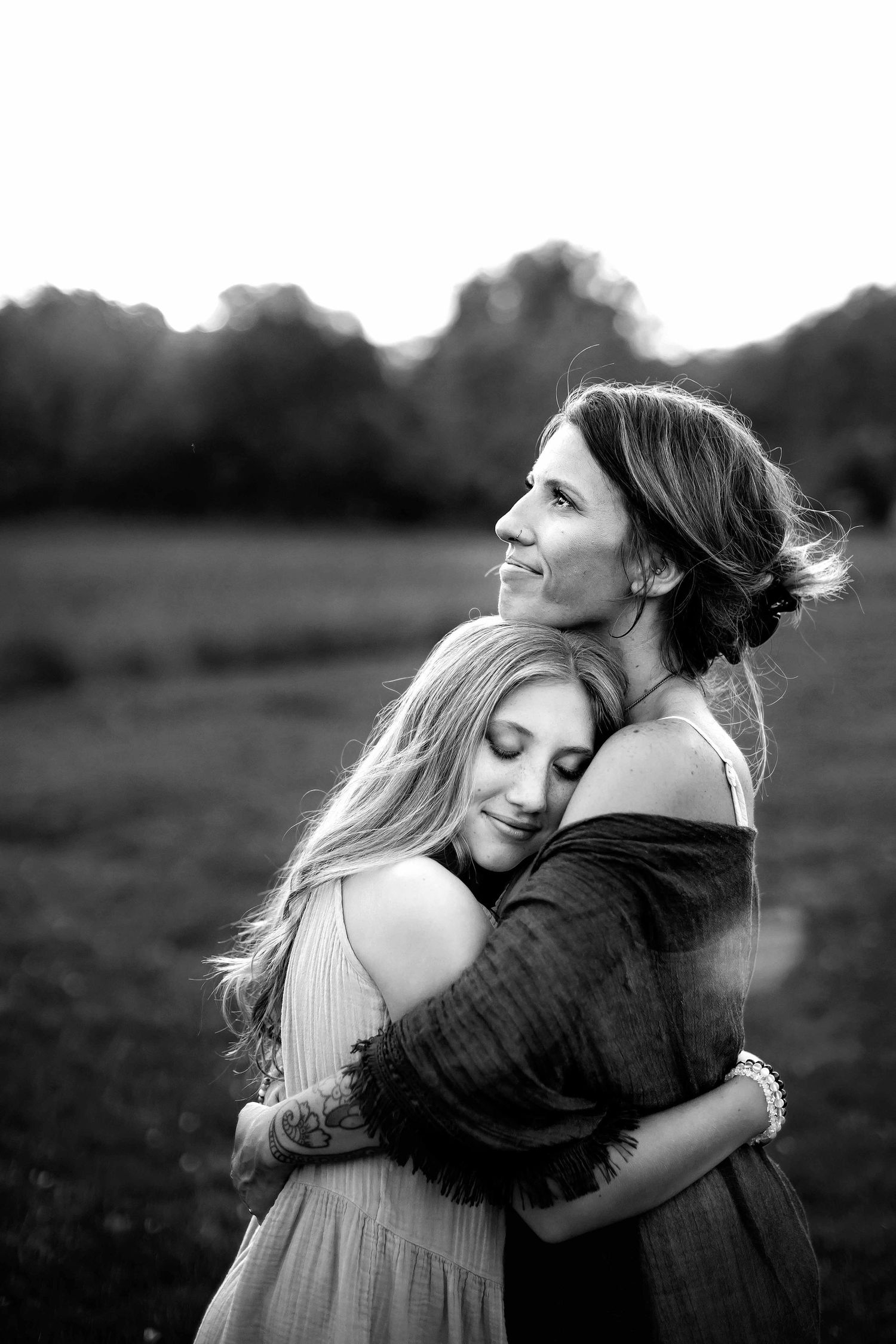 pre-teen daughter hugging mother