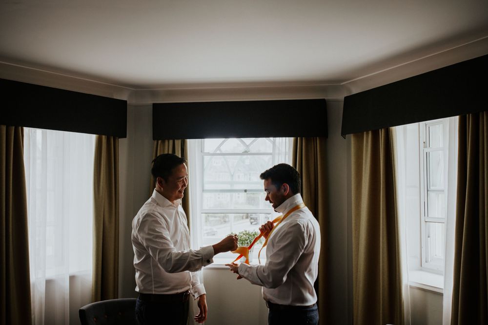 Gay wedding at Arnos Vale  in Bristol , two grooms getting ready photos