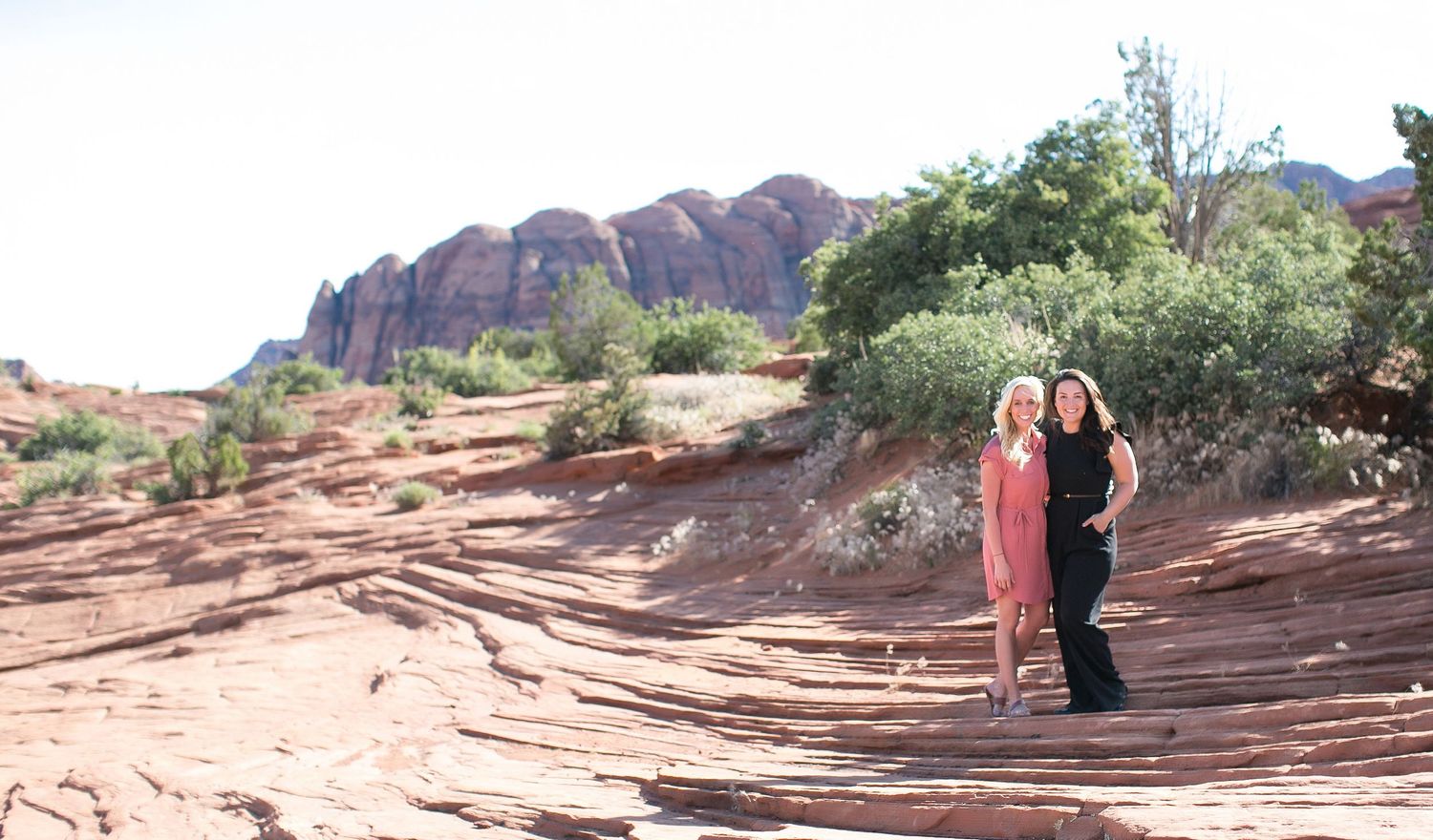 Laura and Kristyn of Laura Leigh Images in Snow Canyon State Park during a adventure destination wedding